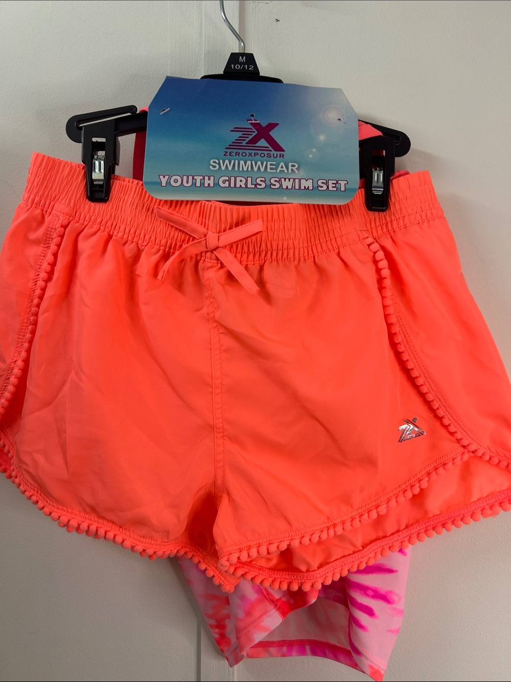 ZeroXposur Neon Coral Girls' Swim Shorts with Pom Trim